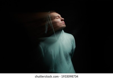 A Man In The Dark. Blurred Portrait In Motion.