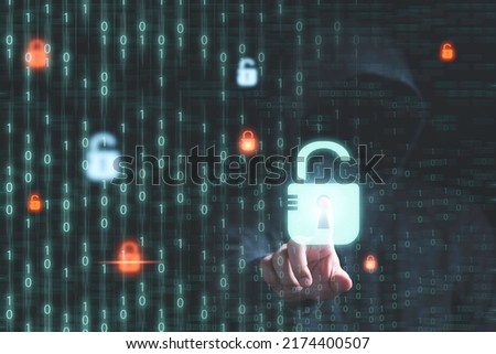 Man in dark hoodie touching to master key to unlock on binary code background for hacker in computer security system and financial technology malware concept.