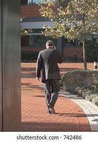 Man Deep In Cellphone Conversation Outside Office