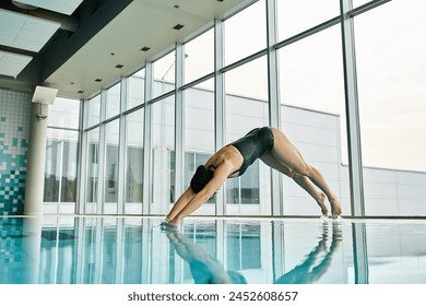 A man defies gravity by doing a handstand on the edge of a swimming pool, showcasing strength and balance.