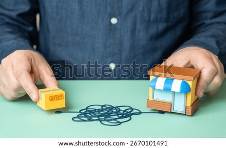 A man demonstrates the complex logistics of delivering goods to store shelves, supply chain difficulties and distribution management