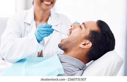 Man, dentist and check teeth with tools for dental cosmetics, healthcare assessment or medical consulting. Patient, tooth or open mouth in oral cleaning with mirror, excavator or orthodontics surgery - Powered by Shutterstock