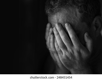 Man in depression, 
hands covered his face
