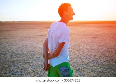 man in the desert at the  sunset