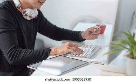 Man designer using tablet and computer creative design at their office.
