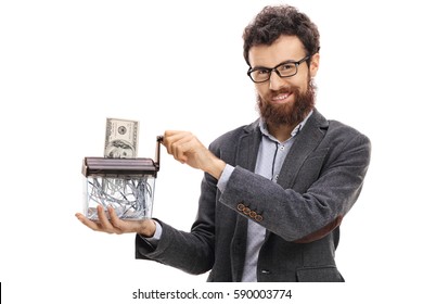 Man destroying a dollar banknote in a paper shredder isolated on white background