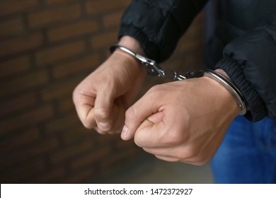 Man Detained In Handcuffs Indoors, Closeup View. Criminal Law