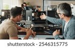 Man, developer and coding teamwork on computer screen in office for testing web application and troubleshooting. Programming, employee or mentor with advice on developing software solution at startup