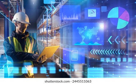 Man develops warehouse tech. Engineer with laptops in storage hangar. Manager uses logistics analytics service. Warehouse racks around worker. Man in sergeant uniform and helmet. Storage tech - Powered by Shutterstock