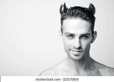 A Man In A Devil Costume On Halloween