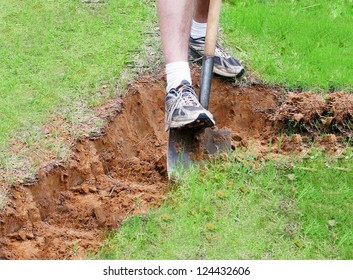 Man Digging A Hole