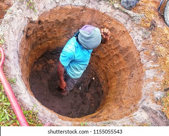 Man Digging A Hole For Septic Tank 