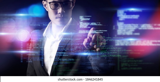 Man And Digital Technology, Asian CEO Business Man Finger Touch Cyber World Digital Screen In Colorful Light Dark Blue Futuristic Artificial Intelligence Coding Background. 