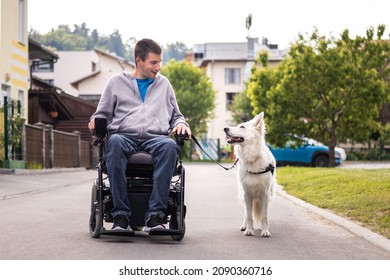 Man With Disability And His Service Dog, A Beautiful White Swiss Shepherd.