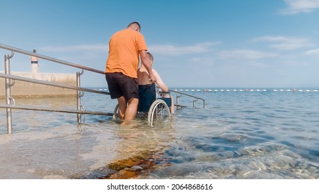 Man Disability On Wheelchair Being Transported Stock Photo 2064868616 ...