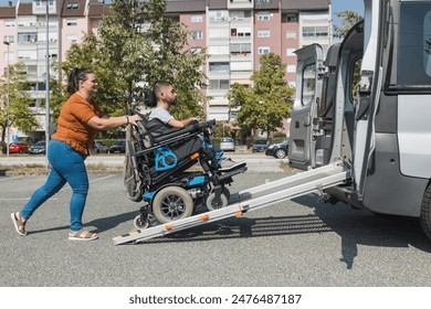 Man with a disability, a wheelchair user getting into an accessible vehicle, with the help of his girlfriend and a ramp for transportation. - Powered by Shutterstock