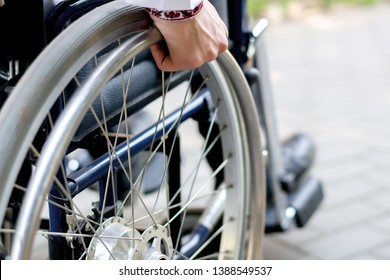 The Man Is Disabled On A Wheelchair. Nature Details Stroller. Back Injury Disease Is Limited. Car Accident. Rehabilitation Recovery After Injury