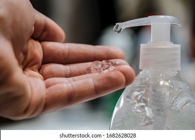 Man disinfecting with hand sanitizer dispenser,corona virus infection disease