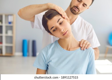 Man doctor chiropractor or osteopath setting womans neck joints with hands during visit and treatment in manual therapy clinic interior. Professional chiropractor during work concept - Powered by Shutterstock