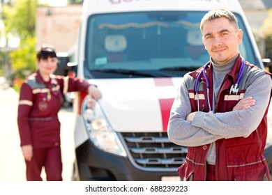 Man doctor with colleague paramedic on ambulance car background - Powered by Shutterstock