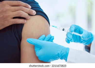 Man, Doctor And Covid Vaccine In Arm By Hospital, Medical And Consulting Healthcare Worker To Stop Spread Of Global Virus. Zoom, Hands And Medicine Injection In Syringe For Security And Safety