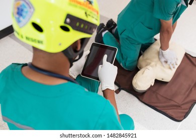 Man doctor using tablet computer in hospital