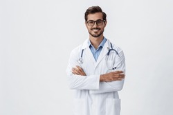 Man Doctor In White Coat And Eyeglasses Smile Shows Hand Gestures Signs On White Isolated Background Looks Into Camera, Copy Space, Space For Text, Health