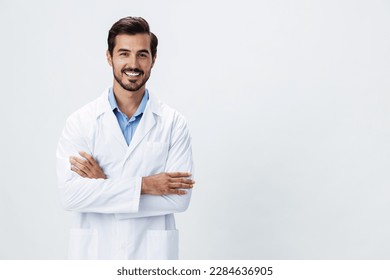 Man doctor in a white coat with a stethoscope smile with teeth and good test results looking into the camera on a white isolated background, copy space, space for text, health - Shutterstock ID 2284636905