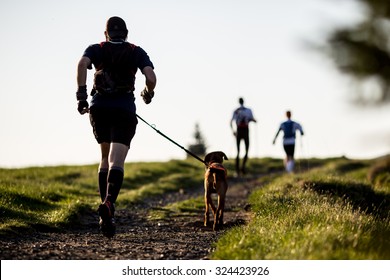 Man with a dog on a morning run