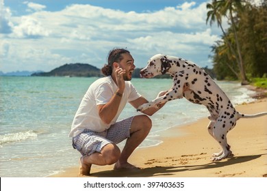 Man With Dog On The Tropical Beach 