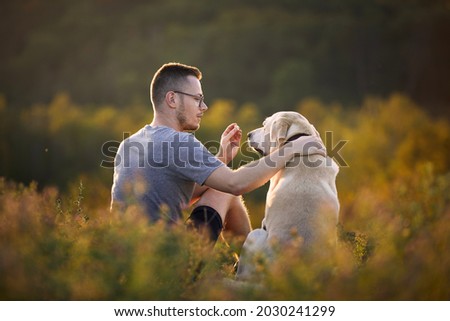 Similar – Image, Stock Photo Happy smiling dog with its pretty young owner