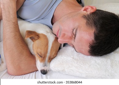 Man And Dog Sleeping Together