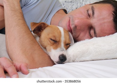 Man And Dog Sleeping Together