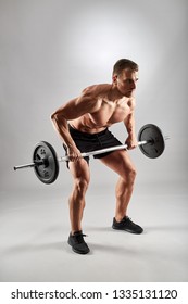 Man Doing Back Workout, Barbell Row In Studio Over Gray Background