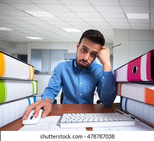 Man Doing A Boring Job On His Computer