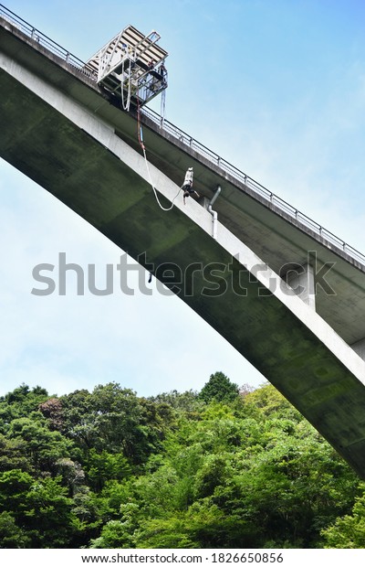 A man doing a bungee\
jump