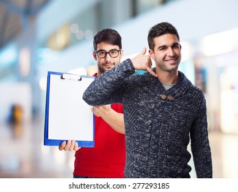 man doing a call gesture