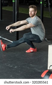 Man Doing Cross Fit Exercise - Pistol Squats 