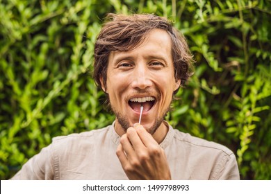 Man Doing DNA Test With Cotton Swab. Test For Home Use