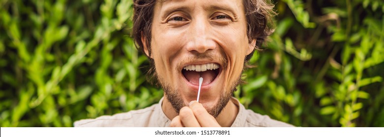 Man Doing DNA Test With Cotton Swab. Test For Home Use BANNER, LONG FORMAT