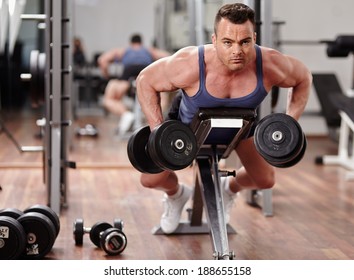 Man Doing Dumbbell Row Workout For Back Muscles 