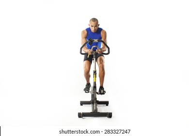 man doing exercise on bike on white background 