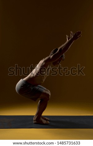 Similar – Mexican yoga teacher practicing side angle pose