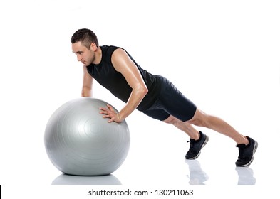 Man Doing Fitness Exercise On Pilates Ball