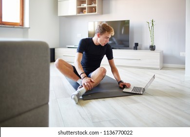 Man Doing Fitness Stretching At Home With App 