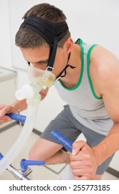 Man Doing Fitness Test On Exercise Bike At The Medical Centre