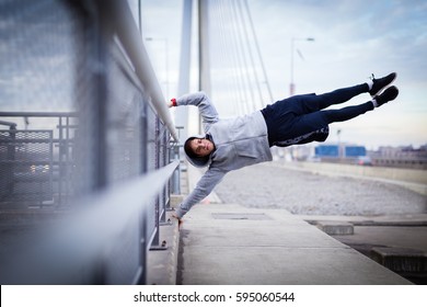 Man doing human flag exercise outdoor - Powered by Shutterstock