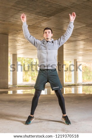 Man doing jumping jacks