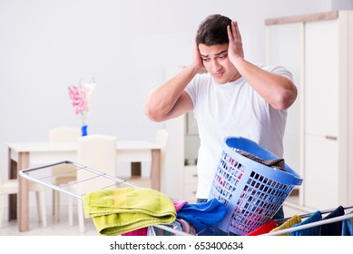 Man Doing Laundry At Home