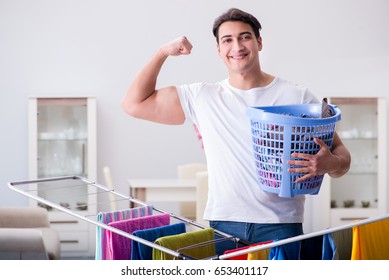 Man Doing Laundry At Home